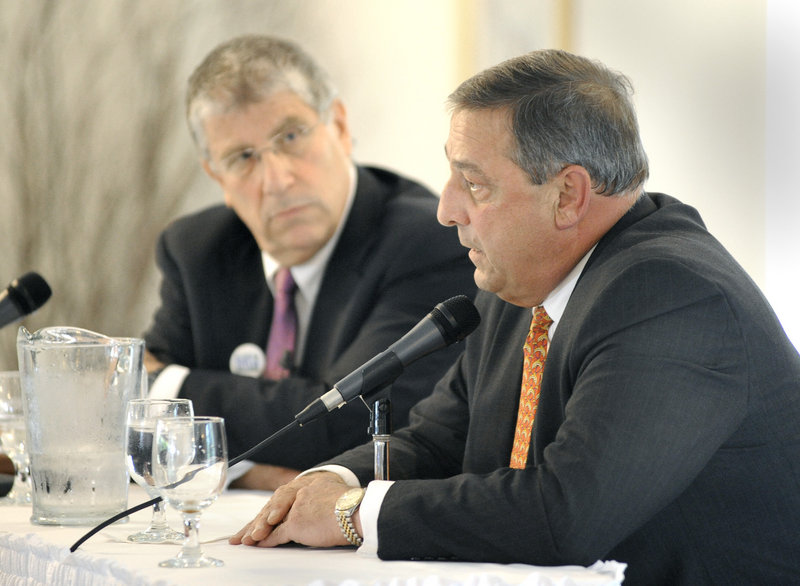 Independent candidate Eliot Cutler listens as Republican Paul LePage comments during a forum focusing on tourism Thursday at the Harraseeket Inn in Freeport. The event covered topics such as support for Maine restaurants and the proposal for a casino in Oxford County.