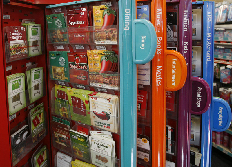 Gift cards are offered for sale from a kiosk in New York. New rules mean users have longer to use the cards and don't face as many costs up front.