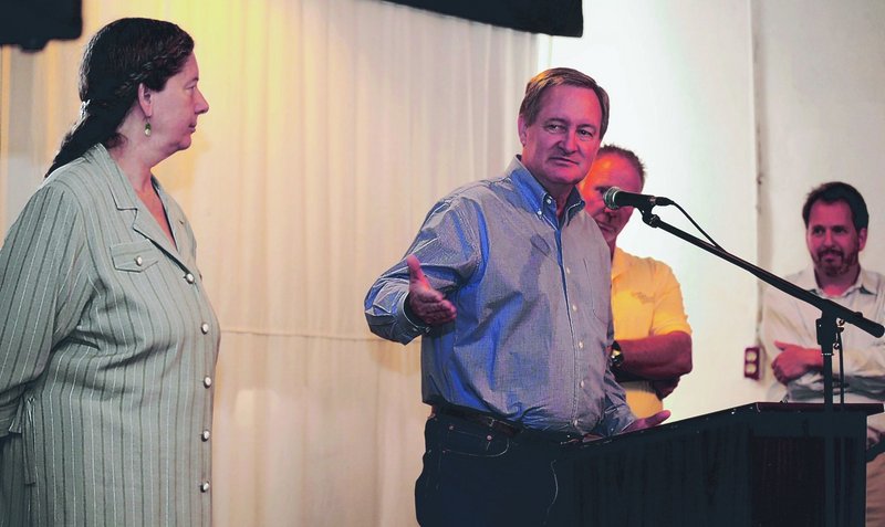 Sen. Mike Crapo speaks about a tax relief bill for small brewers at an August forum in Pocatello, Idaho. Crapo is flanked by Penny Pink, left, owner of Portneuf Valley Brewing; Scott Brown, president of the Idaho Grain Producers Association; and Dan Kopman, right, owner of a brewery in St. Louis, Mo.