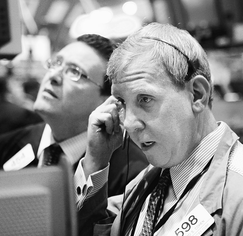 Traders and specialists work on the floor of the New York Stock Exchange earlier this month.