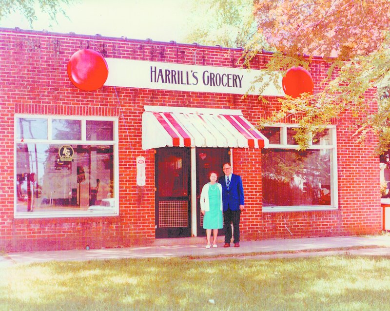 Libby Harrill Mitchell’s parents, Lula Mae and Charlie, pose in front of Harrill’s Grocery, the family store, in this undated photo provided by Libby’s sister, Joyce Childers of Gaffney.