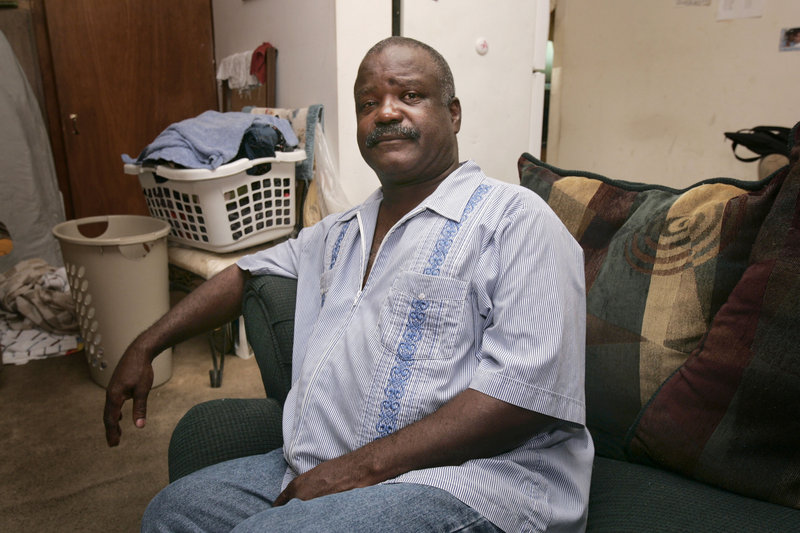 Simon Norwood, a construction worker who struggled to find a job in 2009, poses in a garage apartment belonging to a friend in Little Rock, Ark. Demographers say the level of unemployment closely tracks the poverty rate.