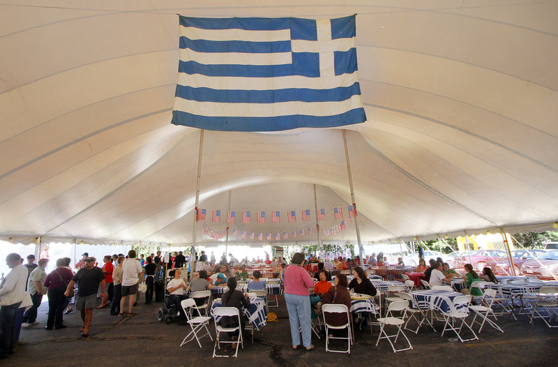 The Greek flag hangs in the festival tent.