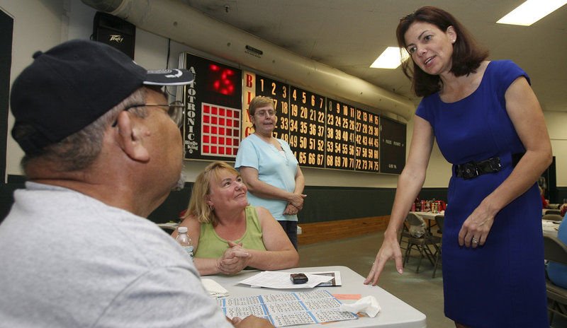 New Hampshire Republican Senate hopeful Kelly Ayotte greets bingo players in Manchester, N.H. Ayotte, a former attorney general, is campaigning as a conservative.