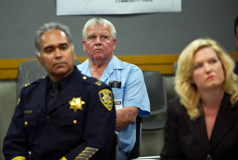 John Vanderheiden, rear, is seen at a July 22 press conference at the San Joaquin County Sheriff's Office in French Camp, Calif., as Tracy, Calif., Police Capt. John Espinoza and state legislator Cathleen Galgiani look on. One of the two men convicted of killing Vanderheiden's daughter is being freed from prison early. "There is no bigger injustice," Vanderheiden said.