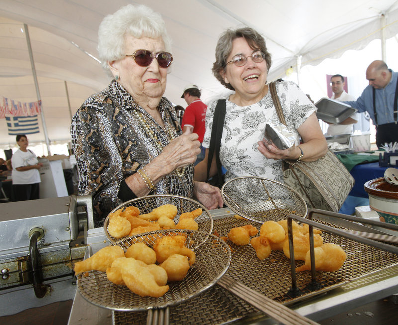 June Dupont, left, and Donna Gagnon order some loukoumades.