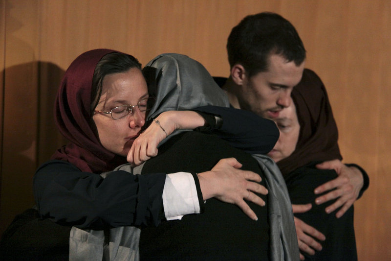 Sarah Shourd, left, hugs her mother, Nora Shourd, as Shane Bauer, second right, hugs his mother, Cindy Hickey, during their meeting at the Esteghlal Hotel in Tehran on May 21.