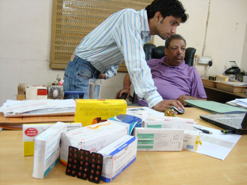 “When we bust one operation, two more spring up elsewhere,” says investigator Suresh Sati, sitting, next to colleague Pankaj Dutt. India has become a center for making and selling fake and substandard medications.