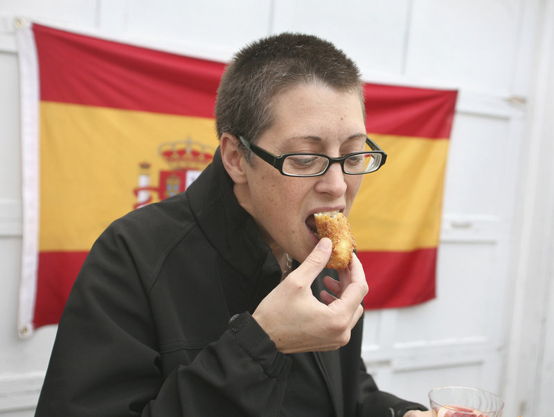 Lisa Panzeri of Portland samples the croquetas de pollo y Jamon Serrano – chicken and bechamel fritters with Serrano ham.