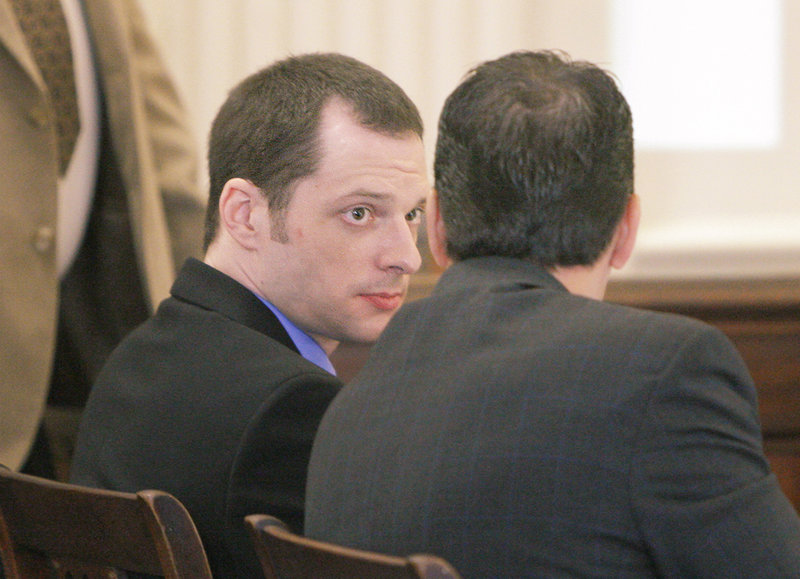 Defendant Jason Twardus listens to one of his lawyers before opening statements at his trial in York County Superior Court in Alfred on Monday.