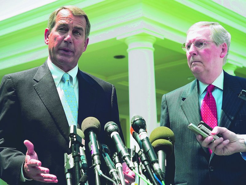 House Minority Leader John Boehner, left, and Senate Minority Leader Mitch McConnell face reporters in June. Boehner now says he would back renewing tax cuts for the middle class but not the wealthy if that was his only choice.