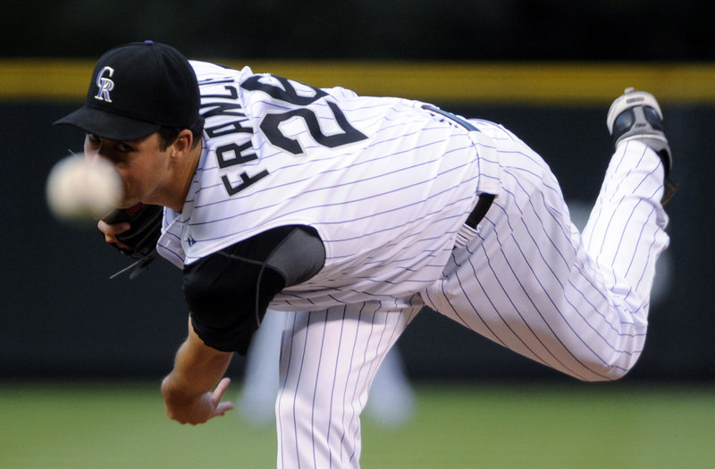 Jeff Francis of the Rockies delivers a pitch Monday against the San Diego Padres. The Padres won 6-4, ending Colorado’s winning streak at 10 games.