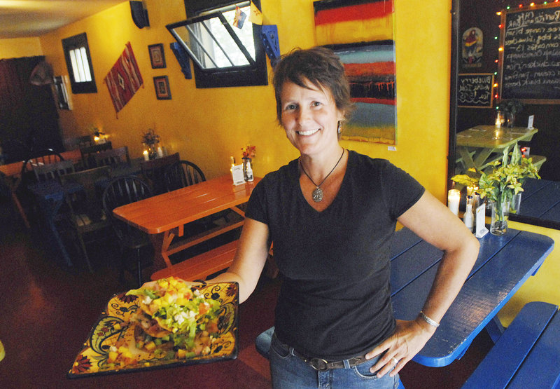 Tanya Dunn, a server at Blue Burrito Cafe in Westbrook, with a blackened baby shrimp tostada.
