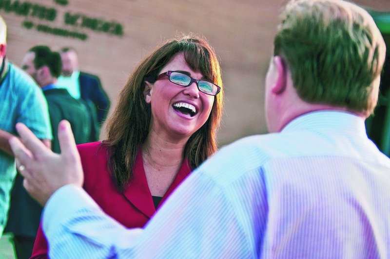 U.S. Senate candidate Christine O'Donnell talks to voters in Wilmington, Del., on Tuesday.