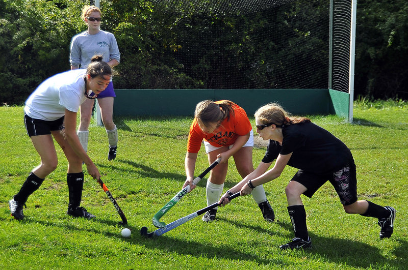 The Rockland and Georges Valley combined field hockey team has shown promise. At practice, Molly Meller of Georges Valley watches as Colleen Haskell of Georges Valley drills with Danielle Bedard, center, and Rachel Freeman of Rockland.