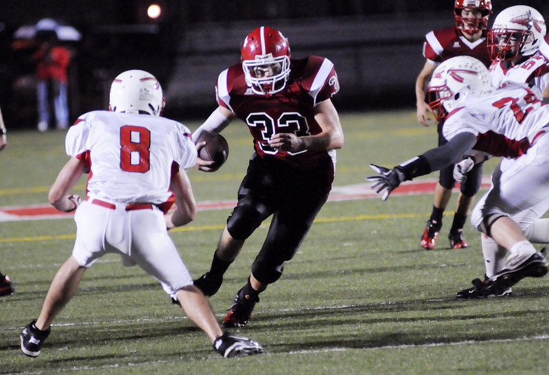 Zach Bean of Scarborough cuts back to the inside Thursday night as he finds a hole against the Sanford defense. Bean rushed for 243 yards on 44 carries and scored both touchdowns in Scarborough’s 14-0 victory.