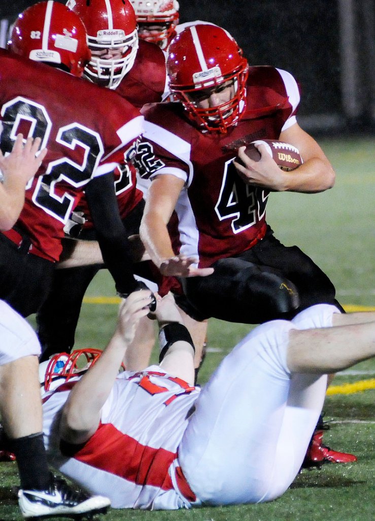 Matt Brown of Scarborough tries to find running room against Sanford. The Red Storm controlled the ball on the ground and ate up six minutes on their second scoring drive.