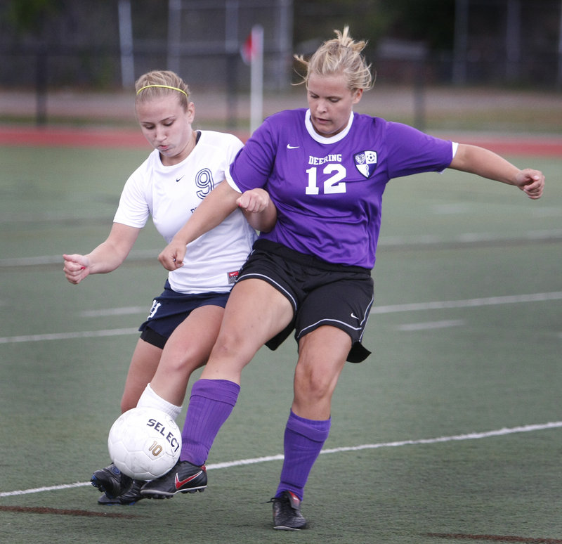 Casey Hart, left, of Portland and Deering's Lily Bourey maneuver for control of the ball during the Rams' 5-0 victory in an SMAA girls' soccer game Friday.