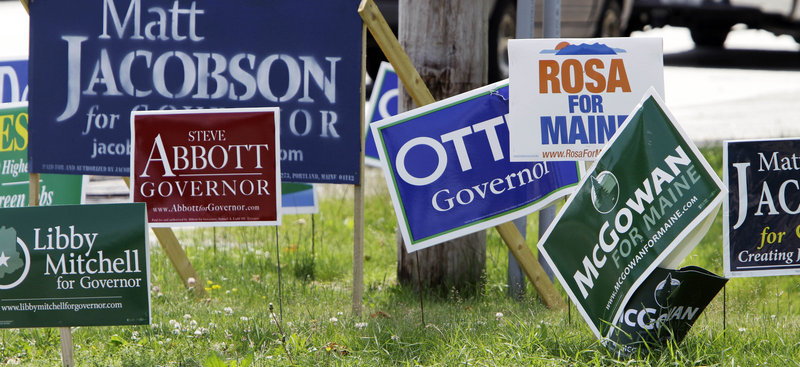 Remember when? Various gubernatorial campaign signs are seen on a corner in Portland on Monday, June 7, the day before Mainers voted for their party candidates in the primary election. Nine candidates saw their bids for the Blaine House end the next night.