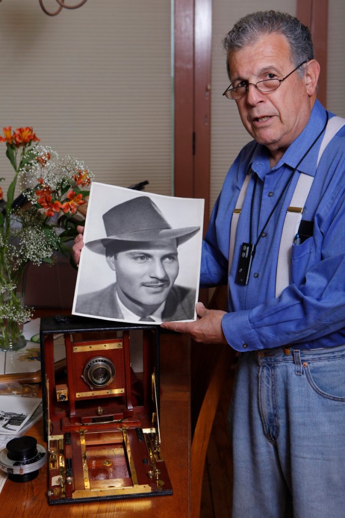 Historian Loren Latker poses with his collection of photographic memorabilia of author Raymond Chandler, creator of the detective Philip Marlowe, at his home in Los Angeles. The remains of the writer and his wife will be reunited on Valentine’s Day next year.