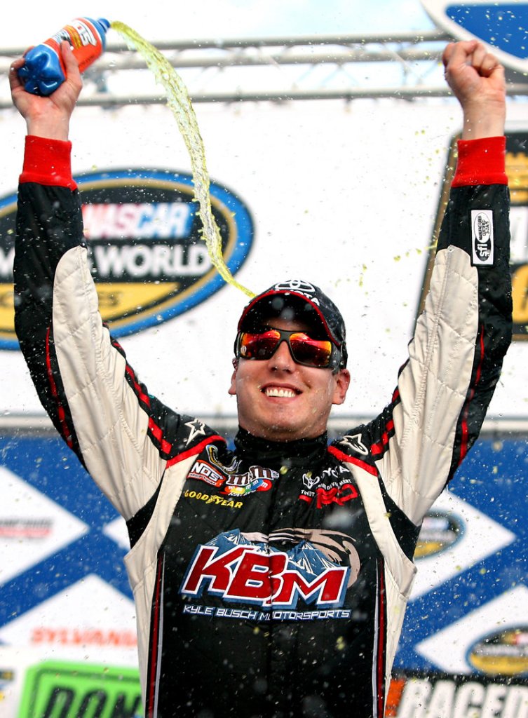 Kyle Busch celebrates after his 80th career NASCAR victory in Saturday's truck series at New Hampshire Motor Speedway.