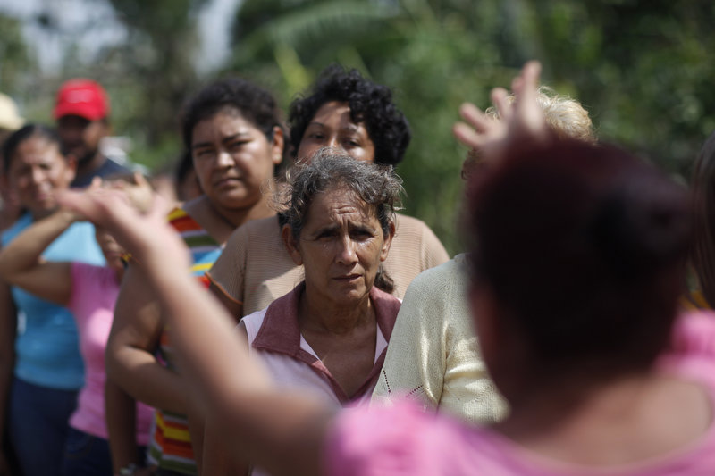 People affected by Hurricane Karl wait in line for food in La Antigua, Veracruz state, Mexico, on Saturday.