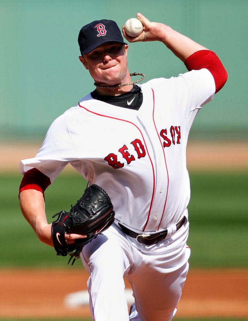 Jon Lester tosses a pitch during his seven innings of shutout ball Sunday against the Toronto Blue Jays. Boston won 6-0.