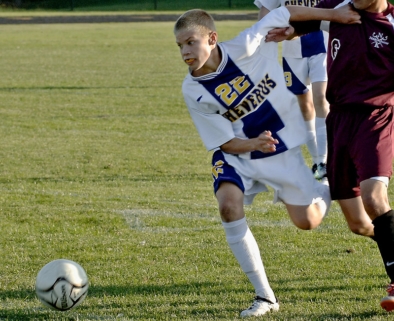 Sterling Weatherbie of Cheverus tries to keep the ball on the move Tuesday during an SMAA boys’ soccer game against Thornton Academy. Cheverus won, 4-2.