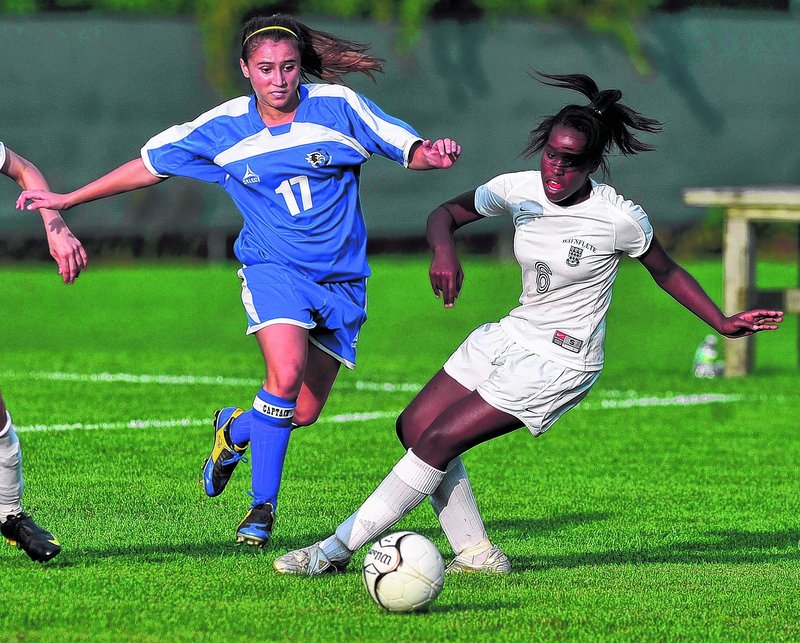 Emily Lane, left, of Sacopee Valley and Waynflete’s Rhiannan Jackson race to the ball Wednesday at Portland. Lane had a goal and set up another in the Hawks’ 2-1 victory.