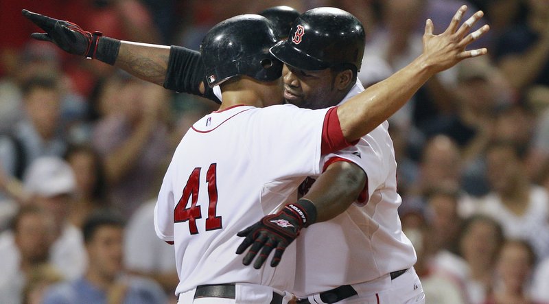 David Ortiz, right, celebrates his three-run fourth-inning home run with Victor Martinez. Ortiz added another RBI as the Red Sox pounded the Orioles for a 6-1 win Wednesday.
