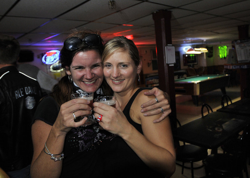 Patrons Norma West, left, of Saco and Jaime Reed of Buxton enjoy a drink at the Buxton Tavern during a recent Ladies’ Night.