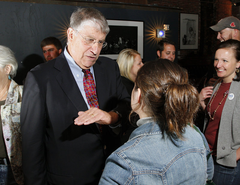 Eliot Cutler, independent candidate for governor, talks to Rori Crossman of Portland at a meet and greet at Empire Dine & Dance in Portland Thursday. Cutler s critics say he s out of touch, but backers say he's ready to take tough steps to address Maine issues.