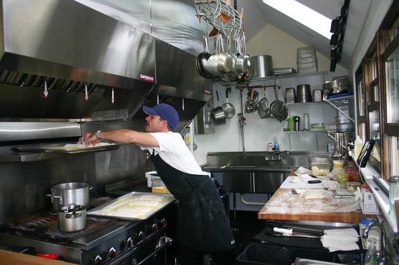 Chef Jason Williams makes ciabatta bread inside the tiny food cart's full-service kitchen.