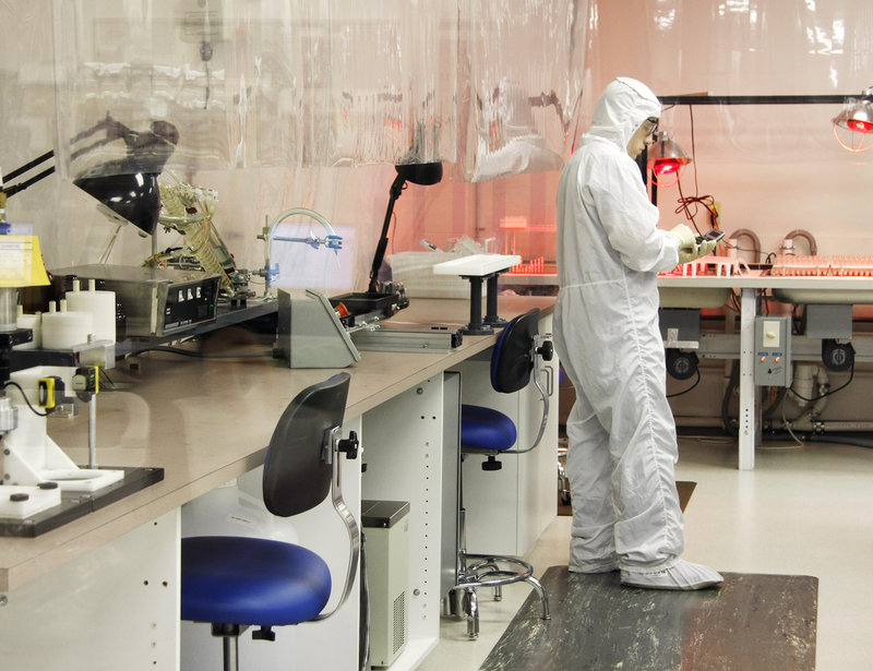 Shawn Willey, a production supervisor, takes inventory in the clean room, which is fed filtered air and entered only by workers wearing head-to-toe coveralls.