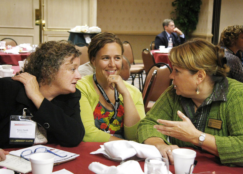 This is a two-line cutline Jill Brady/Staff Photographer:From left, Nancy Smith, Megan Rochelo, and Malory Shaughnessy visit during the Maine Development Foundations 32nd Annual Meeting at the Holiday Inn By the Bay in Portland Friday, September 24, 2010.