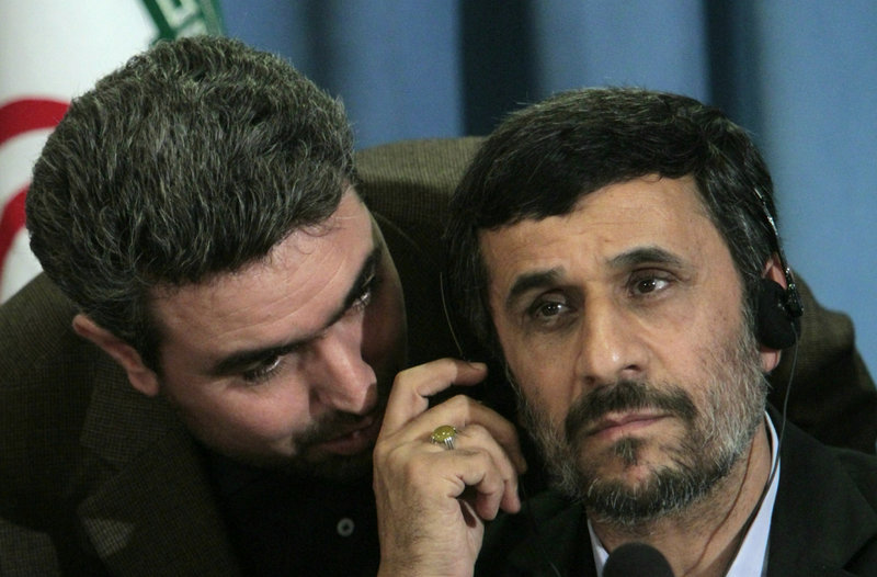 Iranian President Mahmoud Ahmadinejad, right, confers with an aide during a news conference in New York on Friday that ranged from nuclear issues to the Sept. 11 attacks.