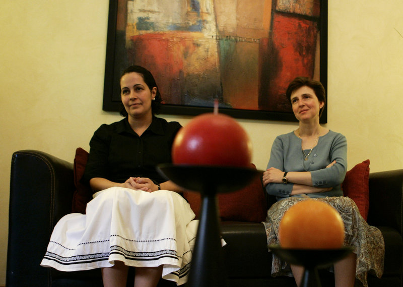 Silvia Vernudez, 37, of Venezuela, left, and Marcela De Maria y Campos, 38, of Mexico, shown during an interview in Rome in June, are lay members of the now-disgraced Legionaries of Christ order who dedicate their lives to the Catholic Church.