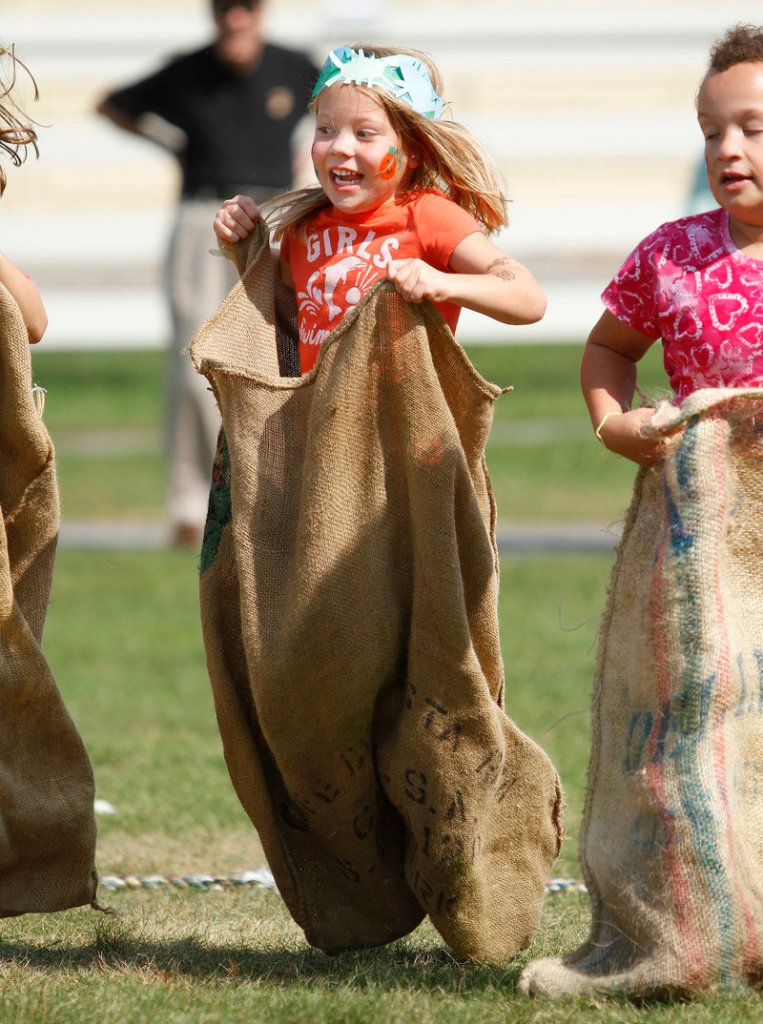 Louise Roper, 4, of Kennebunk bounces through a potato-sack race.