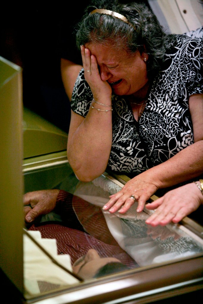 A relative of Prisciliano Rodriguez Salinas, late mayor of the town of Doctor Gonzalez, cries Saturday during his wake in Nuevo Leon state, northern Mexico. Rodriguez Salinas was shot to death Thursday by unknown gunmen.