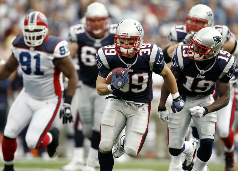 Newly signed running back Danny Woodhead sprints to the end zone for a 22-yard touchdown run in the first half Sunday at Gillette Stadium in Foxborough, Mass. Woodhead, with the team just a week, helped New England beat Buffalo for the 14th straight time.