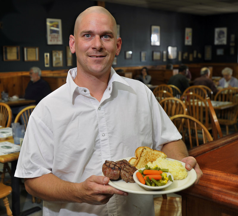 Carl Bernier, head chef at the Fairground Cafe, located at the Topsham Fair Mall, displays a specialty of the house: filet mignon medallions with potato, mixed vegetables and grilled Texas toast.