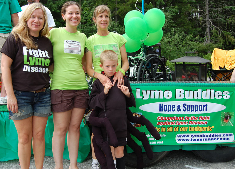 Taking part in the Lyme Buddies float ride at the Yarmouth Clam Festival, from left, were Amie Levasseur, Jessica Platanitis, Angela Coulombe and her son Elliot Woznica-Coulombe. The Lyme Buddies float won second place for nonprofits.
