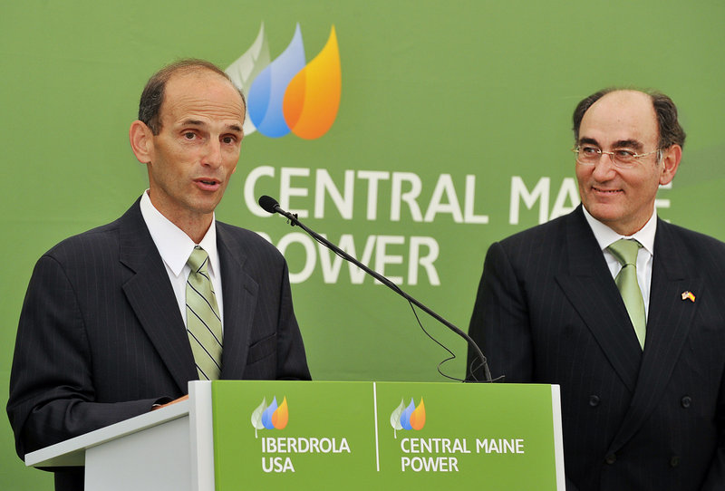 Gov. John Baldacci praises Iberdrola Group Chairman Ignacio Galan, right, for his company’s commitment to Maine’s power needs at a news conference Tuesday in Gorham.