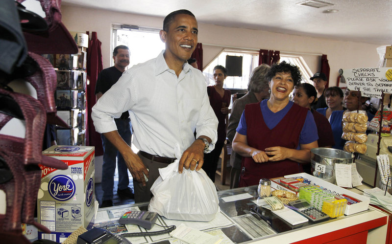 President Obama picks up Mexican food at Barelas Coffee House Tuesday in Albuquerque, N.M., one of several stops he has made as he works to rally Democrats for midterm elections.