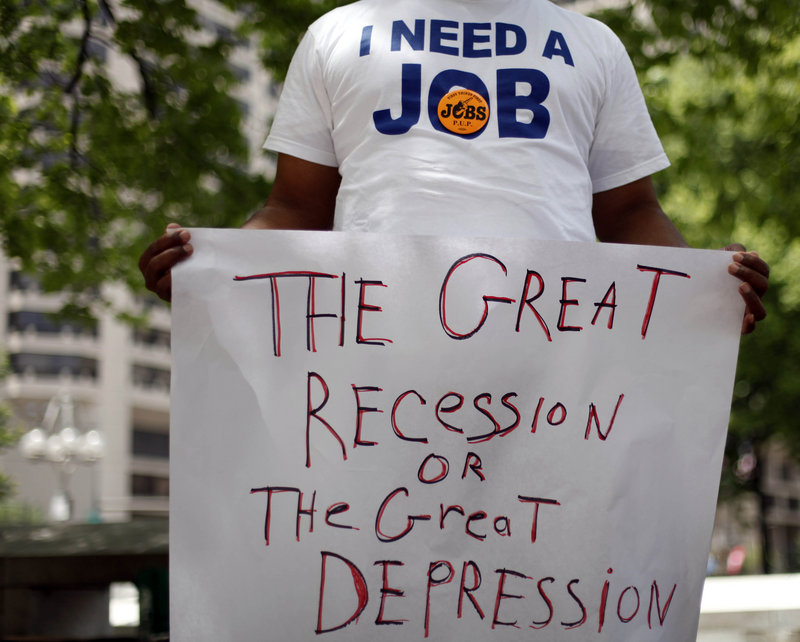 An unemployed man holds a sign at a rally organized in June of this year by the Philadelphia Unemployment Project in Philadelphia. The number of people in poverty rose in 31 states from 2008 through 2009 and no state showed a decline.