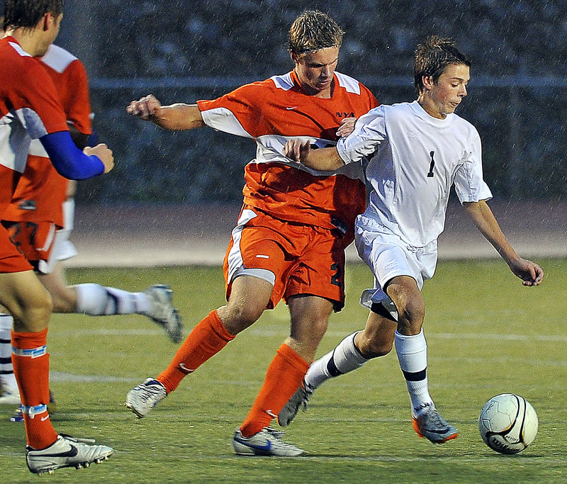 David Murphy of Yarmouth, right, keeps the ball from Michael Ianno of North Yarmouth Academy during their Western Maine Conference game Tuesday night. Yarmouth scored in the second half for a 1-0 victory.