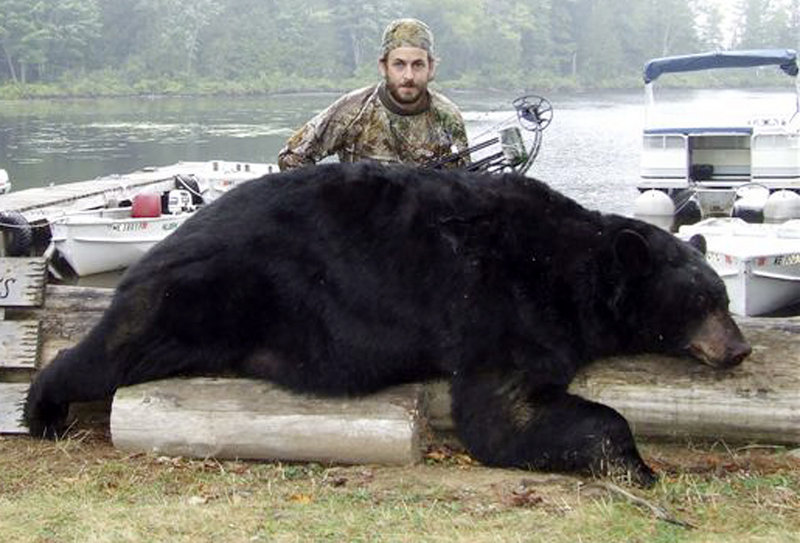 This Sept. 8 photo shows Dave Rizkallah of Derry, N.H., with a black bear weighing more than 600 pounds, which he shot and killed with a bow and arrow near Danforth, Maine. Wildlife officials say it was the second-largest bear taken in Maine.