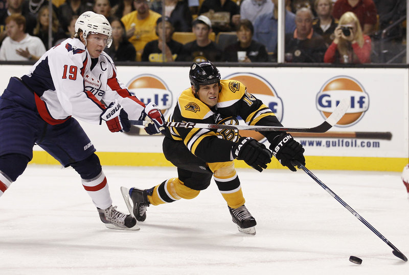 Nathan Horton of the Bruins reaches for the puck while pestered by Washington’s Nicklas Backstrom during the Capitals’ 4-1 exhibition victory Wednesday night.