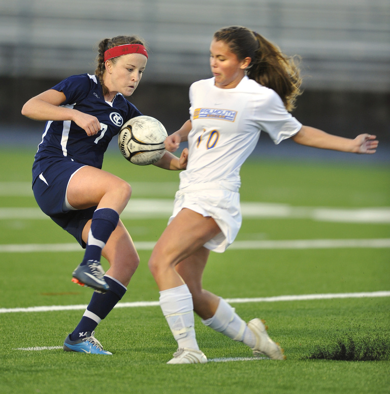 Rebecca Bell of Yarmouth, left, and Jamie Sabo of Falmouth contend for a bouncing ball near midfield in their 0-0 tie Tuesday.