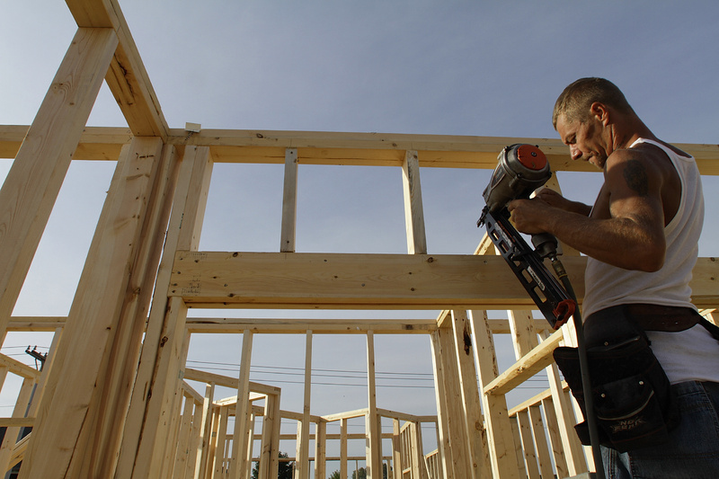 Construction worker Randy Shreves begins building a new home in Springfield, Ill., in September.